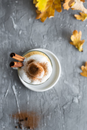 Spicy latte with cinnamon, pumpkin and whipped cream. Pumpkin latte in autumn mood. High quality photo.の写真素材