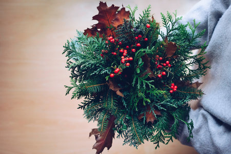 Rich autumn bouquet in the hands of a girl on a light backgroundの写真素材