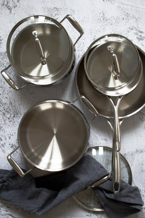 Set of stainless pots with lidsの写真素材