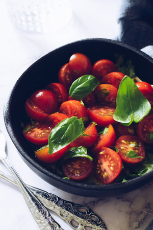 Healthy salad with cherry tomatoes and basilの写真素材