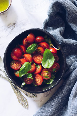 Healthy salad with cherry tomatoes and basilの写真素材
