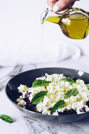 Healthy salad with beet root, cottage cheese and basilの写真素材