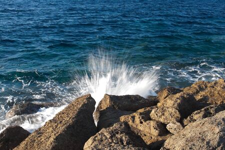 splashing waves off the coastの写真素材