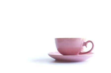 Pink porcelain cup of tea on white background. Card, poster, mock up. Celebrating, anniversary, birthday concept. Banner, mock up menu, posterの写真素材