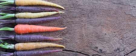 rustic kitchen with raw vegetables on old wood. Top view. Fresh carrotsの写真素材