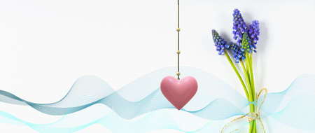elegant beautiful spring greeting card, spring blue bunch of flowers, hanging pink heart on white....