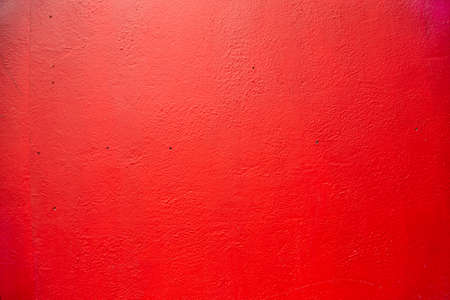 Red wall. Old house facade wall painted in red. Old English house facadeの写真素材