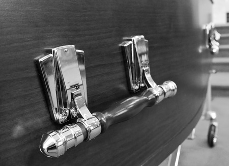 closeup shot of a colorful casket in a hearse or chapel before funeralの写真素材