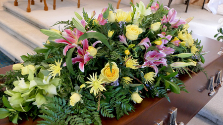 closeup shot of a colorful casket in a hearse or chapel before funeralの写真素材
