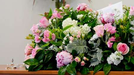 closeup shot of a colorful casket in a hearse or chapel before funeralの写真素材