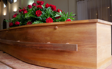 closeup shot of a colorful casket in a hearse or chapel before funeralの写真素材
