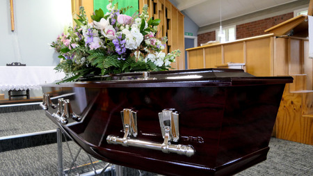 closeup shot of a colorful casket in a hearse or chapel before funeralの写真素材