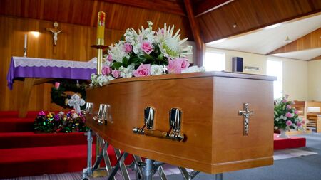 closeup shot of a colorful casket in a hearse or chapel before funeralの写真素材