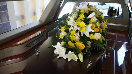 closeup shot of a colorful casket in a hearse or chapel before funeralのeditorial素材