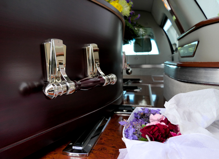 closeup shot of a colorful casket in a hearse before funeralの写真素材
