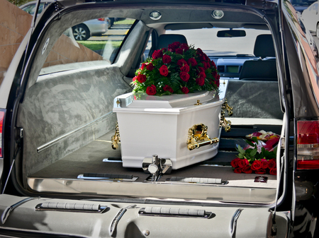 closeup shot of a colorful casket in a hearse before funeralのeditorial素材