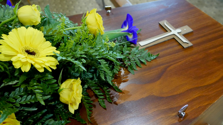 closeup shot of a colorful casket in a hearse or chapel before funeral or burial at cemeteryのeditorial素材