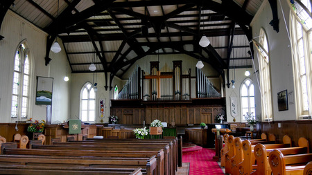closeup shot of a colorful casket in a hearse or chapel before funeral or burial at cemeteryのeditorial素材