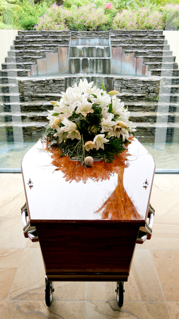Closeup shot of a colorful casket in a hearse or chapel before funeral or burial at cemeteryの写真素材