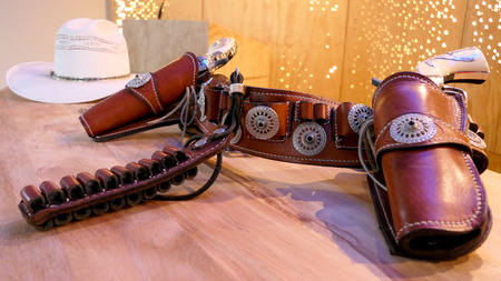 shot of cowboy hat & guns & pistols & belts