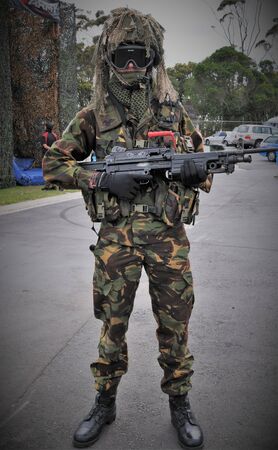 shot of New Zealand army special forces displaying their weapons