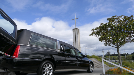 Shot of hearse arriving or leaving a funeralの写真素材
