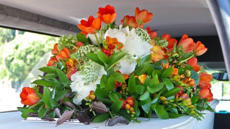closeup shot of a funeral casket in a hearse or chapel or burial at cemeteryの写真素材