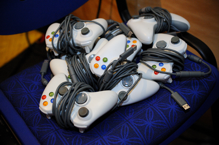 gamers competing in cyber games using computers, gaming consoles and gadgets