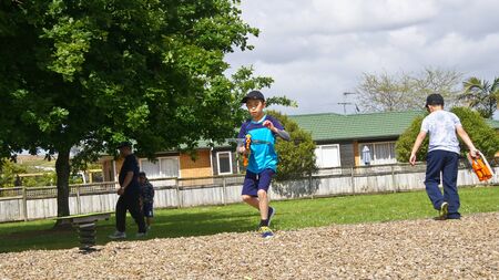 Auckland, New Zealand, 10th of Nov 2019, adults and kids playing nerf gun together at an outdoor children playgroundのeditorial素材