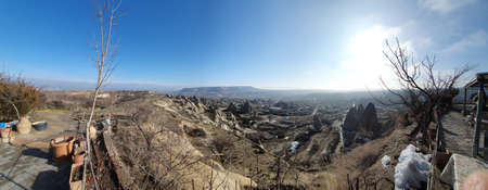 Goreme valley with ancient chapels carved into hillside, Cappadocia, Turkey