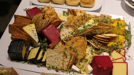 variety of cheese bread biscuits ham salami cracker