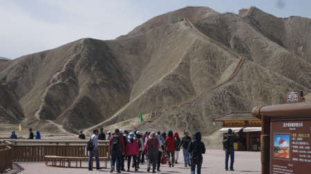 ZhangYe, China, 1st of Jan 2020, tourists visiting the ZhangYe Rainbow Mountain, Danxia,  a unique...
