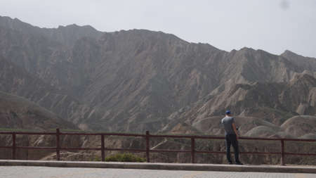 ZhangYe, China, 1st of Jan 2020, tourists visiting the ZhangYe Rainbow Mountain, Danxia,  a unique...