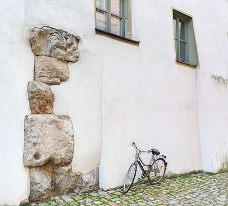 Bicycle leaning against a stone wall in the old town of Tallinn, Estoniaの写真素材