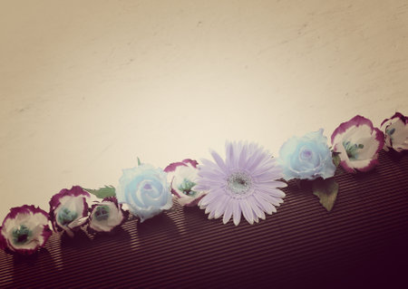 Colorful flowers on wooden background with filter effect retro vintage style.の写真素材