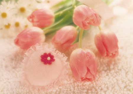 Bouquet of pink tulips on a white towel, soft focus backgroundの写真素材