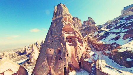Goreme valley with ancient cave chapels houses carved into mountain hillside, Cappadocia, Turkeyの写真素材
