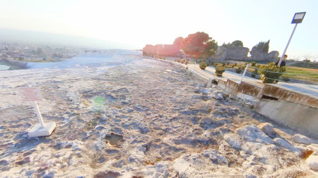 Landscape view of the white lime cascades travertine pools terraces formed by hot mineral springs at Pamukkale, Turkeyの写真素材