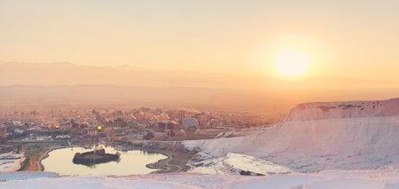 sunset view of the white lime cascades formed by hot mineral springs at Pamukkale, Turkeyの写真素材