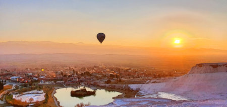 Wide shot of Hot air ballooning at Pamukkale, Turkey during sunriseの写真素材