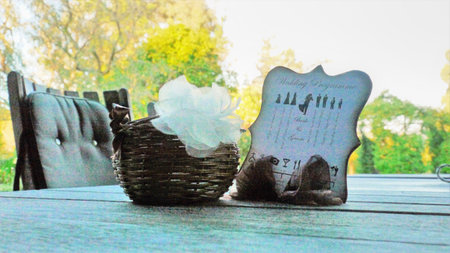 Wedding wicker basket with a bouquet of white flowersの写真素材
