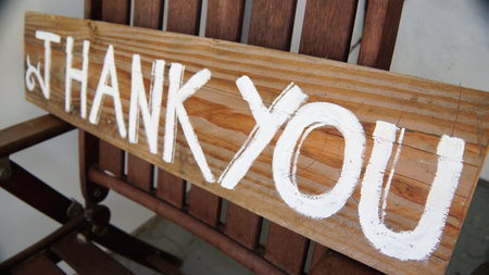 Thank you sign on wooden benchの写真素材