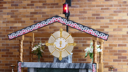 Church altar with a golden cross in the shape of a crown of thornsの写真素材