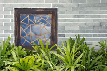 Window on brick enclosure wall
