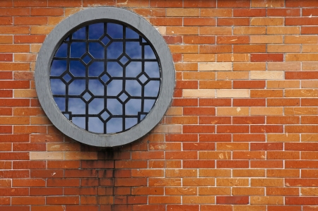 Window on brick enclosure wall     の写真素材