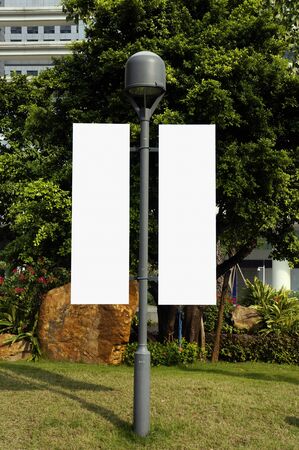 Blank signpost on lamppostの写真素材