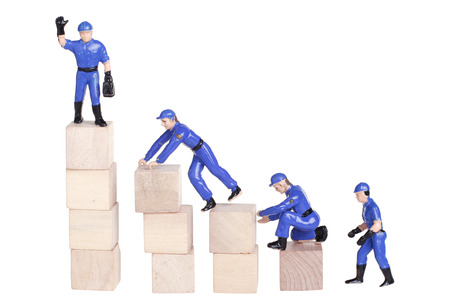 Teamwork concept dolls figure isolated on whiteの写真素材