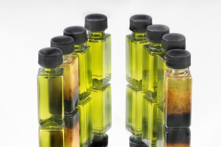 olive oil bottle isolated on whiteの写真素材