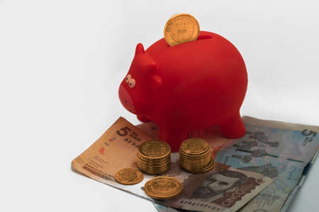 Colombian peso money - coins in a piggy bankの写真素材