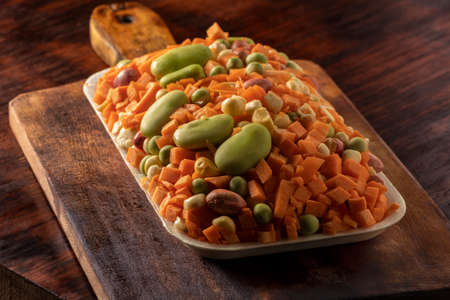 Tray of different peasant vegetables beans-carrot-peas-carrot-carrot-curly cornの写真素材